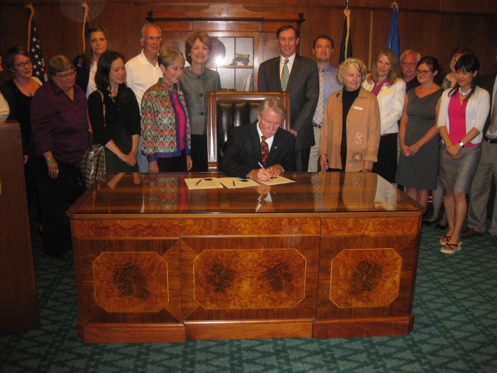 The Governor signing HB 5208 #2